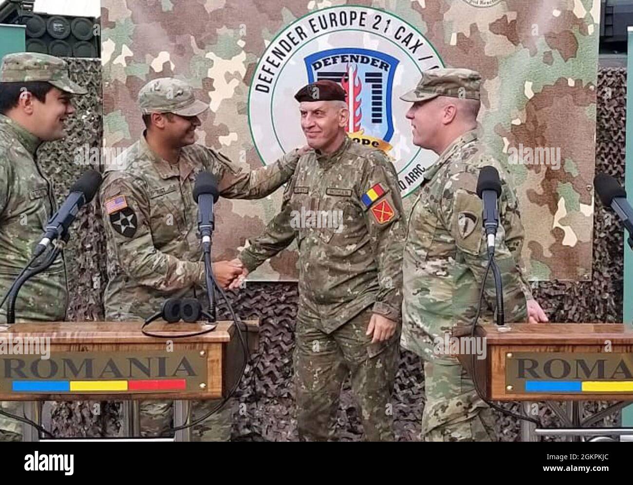 U.S. Army Reserve Maj. Allen Rust, an air and missile defense chief with the 209th Digital Liaison Detachment, 7th Mission Support Command, left, shakes hands with Romanian Army Col. Adrian Petrica of the Multi-National Command Southeast, at the close of a DEFENDER-Europe 21 command post exercise in Bucharest, Romania, June 14, 2021. The 209th DLD provided liaison capability between the U.S. Army´s V Corps, Joint Force Land Component Command and the Romanian MNC-SE. Stock Photo