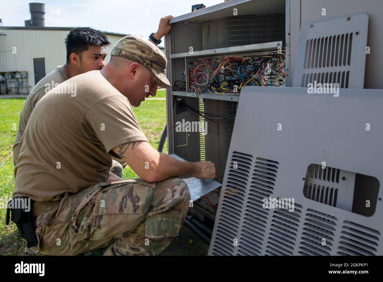 Senior Airman Joje Masaganda, left, and Staff Sgt. Mitchell Cole, 4th