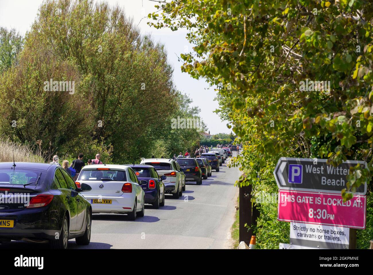 Day trippers going bumper to bumper along the entrance road to West