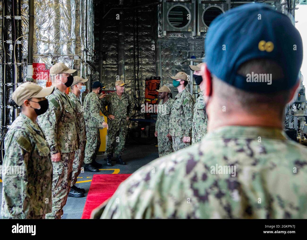 OKINAWA, Japan (June 15, 2021) Rear Adm. Christopher Engdahl, center ...