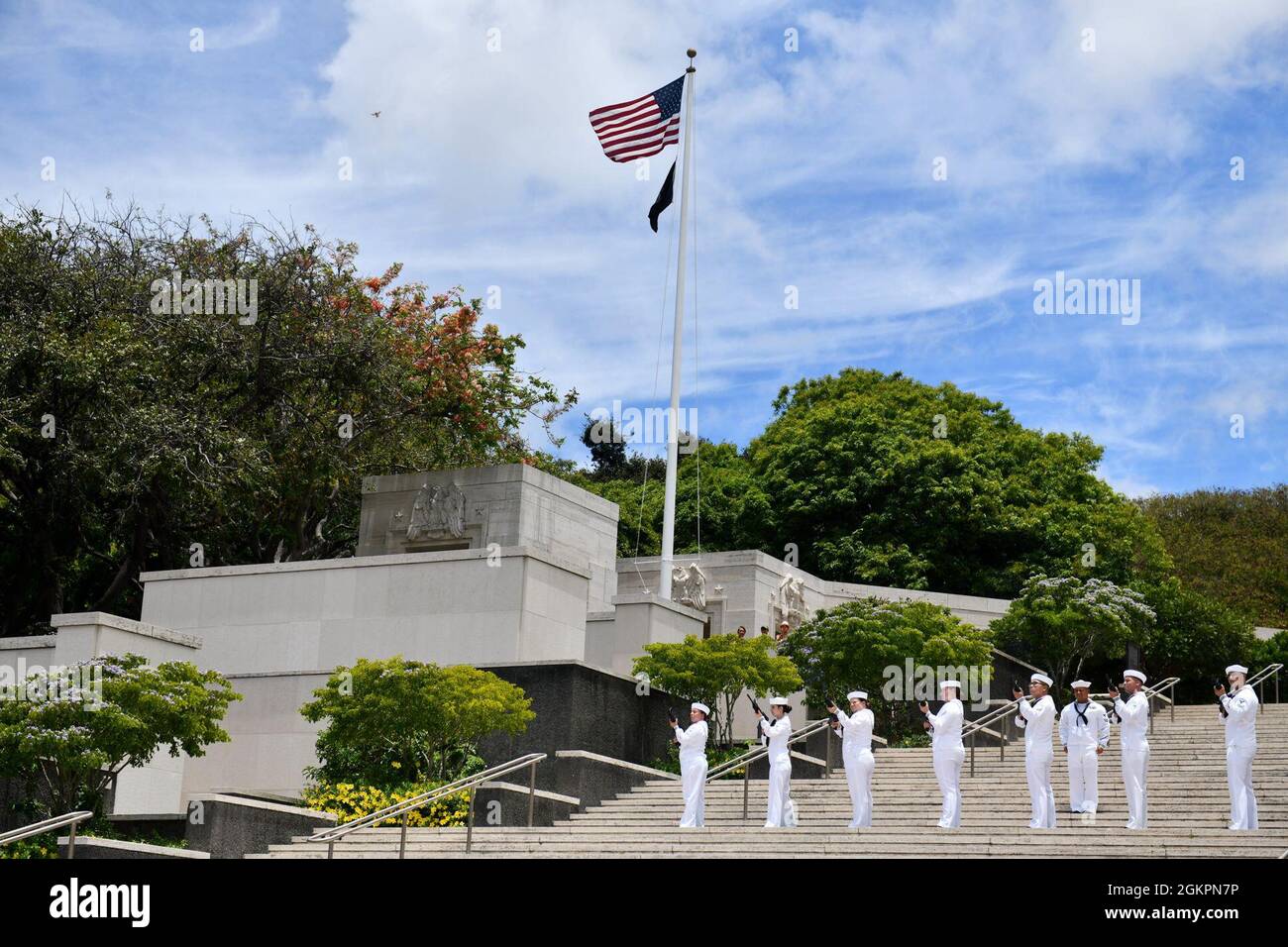 Members of the U.S. Navy Region Hawaii Honor Guard  fire a volley during a funeral for the Trapp brothers at the National Memorial Cemetery of the Pacific, Honolulu, Hawaii, June 15, 2021. The Trapp brothers were assigned to the USS Oklahoma, which sustained fire from Japanese aircraft and multiple torpedo hits causing the ship to capsize and resulted in the deaths of more than 400 crew members on Dec. 7, 1941, at Ford Island, Pearl Harbor. The Trapp brothers were recently identified through DNA analysis by the Defense POW/MIA Accounting Agency (DPAA) forensic laboratory and laid to rest with Stock Photo