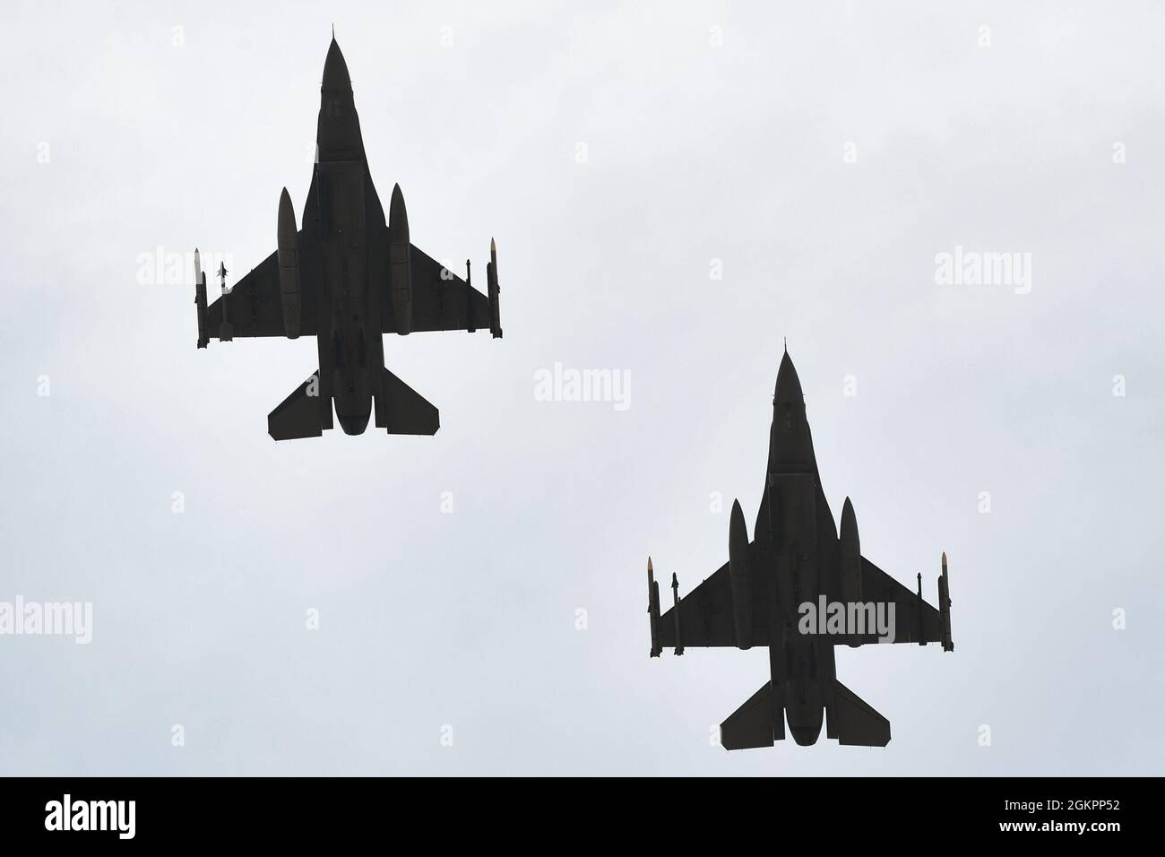 Two U.S. Air Force F-16 Fighting Falcons, assigned to the 510th Fighter Squadron, fly over Ben Guerir Air Base, Morocco, 15 June 2021, during Exercise African Lion 2021. African Lion is a critical opportunity for members of the joint team to build and test their strategic readiness to deploy, fight and win in a complex, multi-domain environment.  African Lion is U.S. Africa Command’s largest, premier, joint, annual exercise hosted by Morocco, Tunisia and Senegal, 7-18 June. More than 7,000 participants from nine nations and NATO train together with a focus on enhancing readiness for U.S. and p Stock Photo