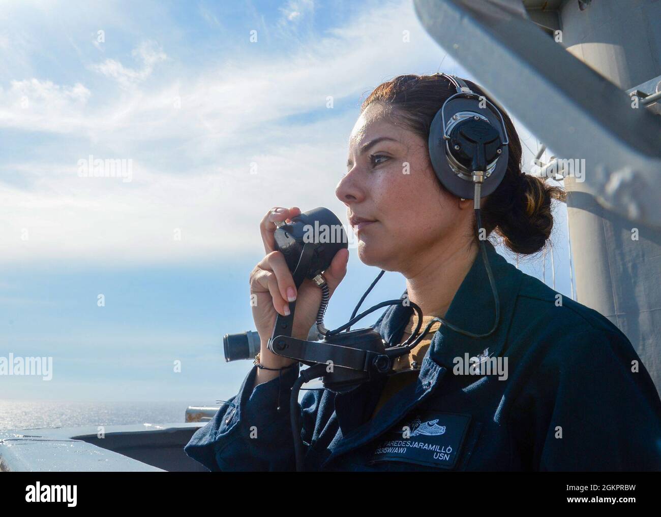 210615-N-PG226-1001 ATLANTIC OCEAN (May 15, 2021) Operations Specialist 3rd Class Stephany Peredezjamarillo, from Miami, communicates using a sound-powered telephone while standing aft lookout watch on the lookout bridge aboard the Nimitz-class aircraft carrier USS Harry S. Truman (CVN 75) during Tailored Ship’s Training Availability (TSTA) and Final Evaluation Problem (FEP). Harry S. Truman, with embarked Carrier Air Wing 1, is underway conducting TSTA and FEP to assess their ability to conduct combat missions, support functions and survive complex casualty control situations in preparation f Stock Photo