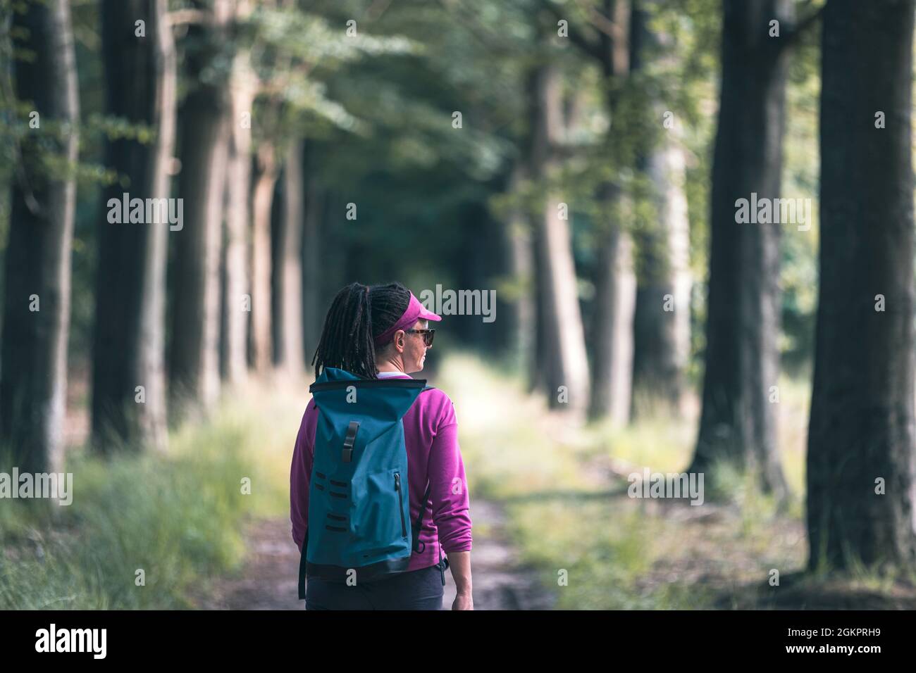 Woman walking in the forest hi-res stock photography and images - Alamy