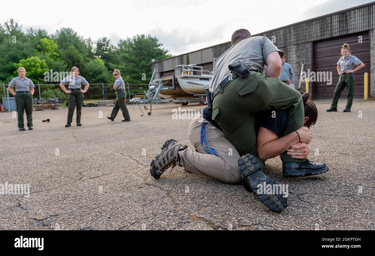 Park rangers from the U.S. Army Corps of Engineers Pittsburgh District train on self-defense tactics at Crooked Creek Lake in Ford City, Pennsylvania, June 15, 2021, as part of a five-day Visitor Assistance course. District rangers who complete the course earn their park ranger badge and citation authority to enforce Title 36, which covers rules and regulations on federally owned parks and forests among other properties. Stock Photo