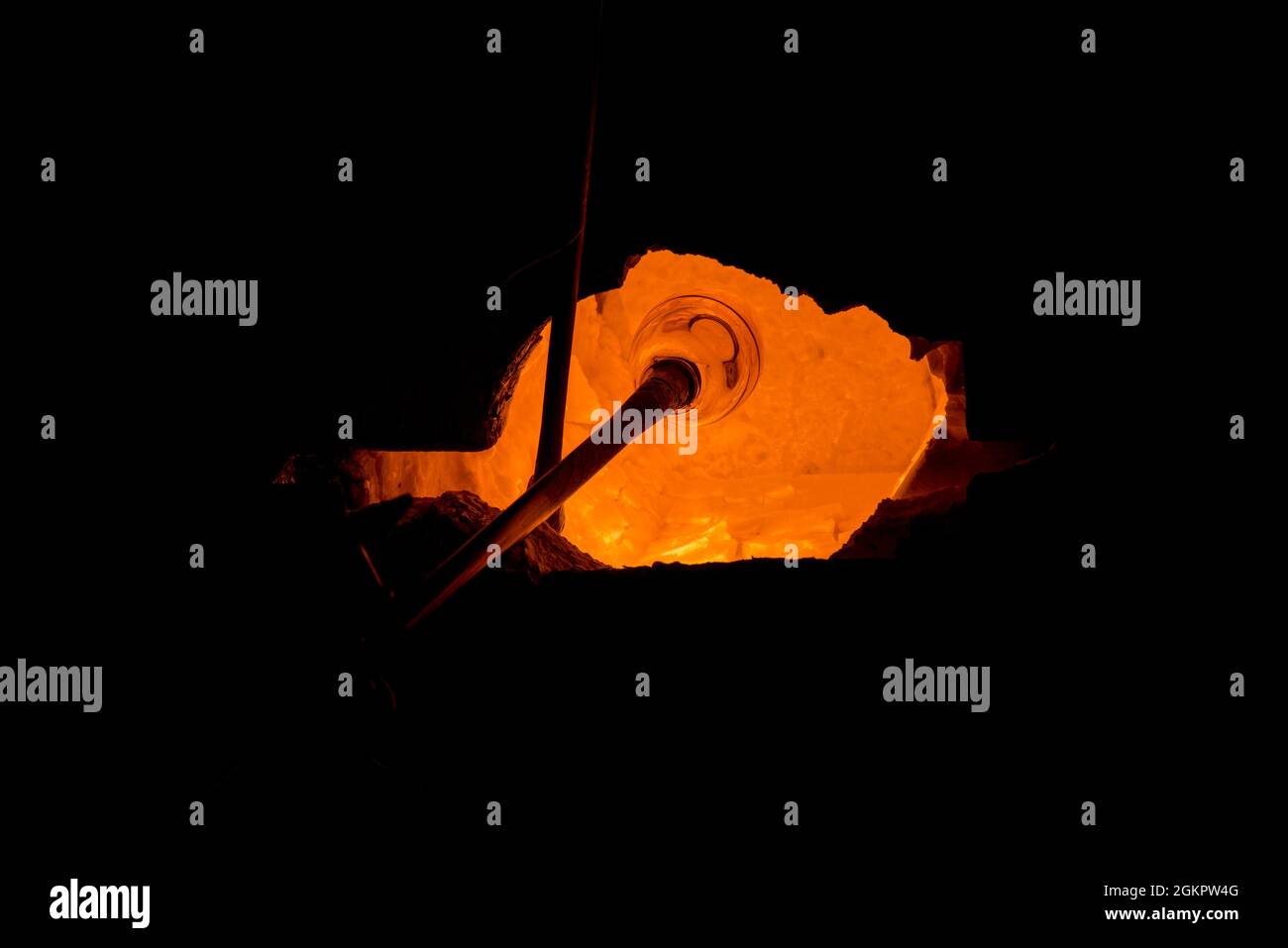 Glassmaker's the glass is in the oven to melt before forming