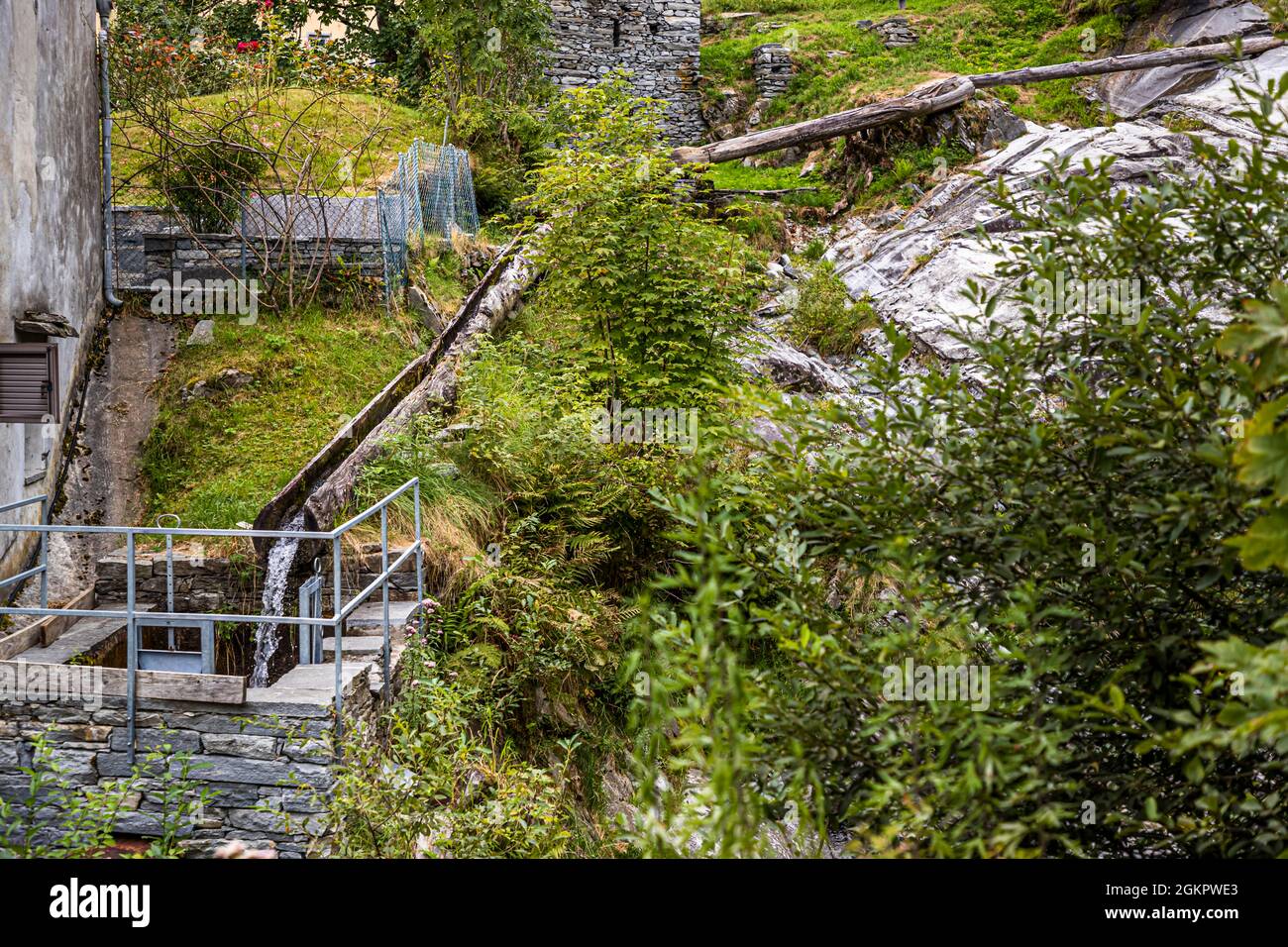 Where once five mills were located below each other, even today the water flows partly through hollowed tree trunks. Vergeletto, with its original five mills, is something like the birthplace of the Farina bóna in Circolo d'Onsernone, Switzerland Stock Photo