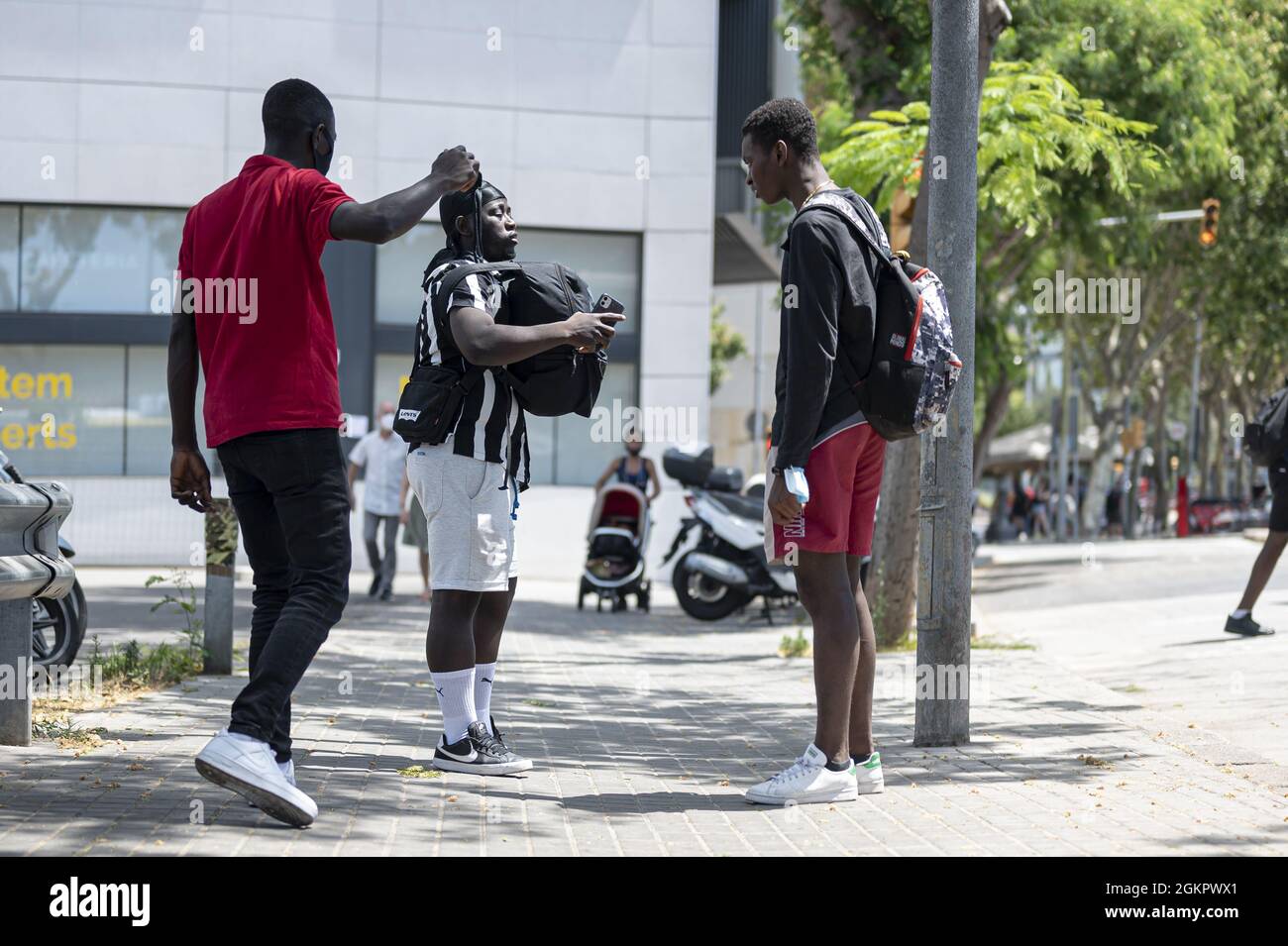 BARCELONA, SPAIN - Aug 25, 2021: A group of young black men on the city street Stock Photo