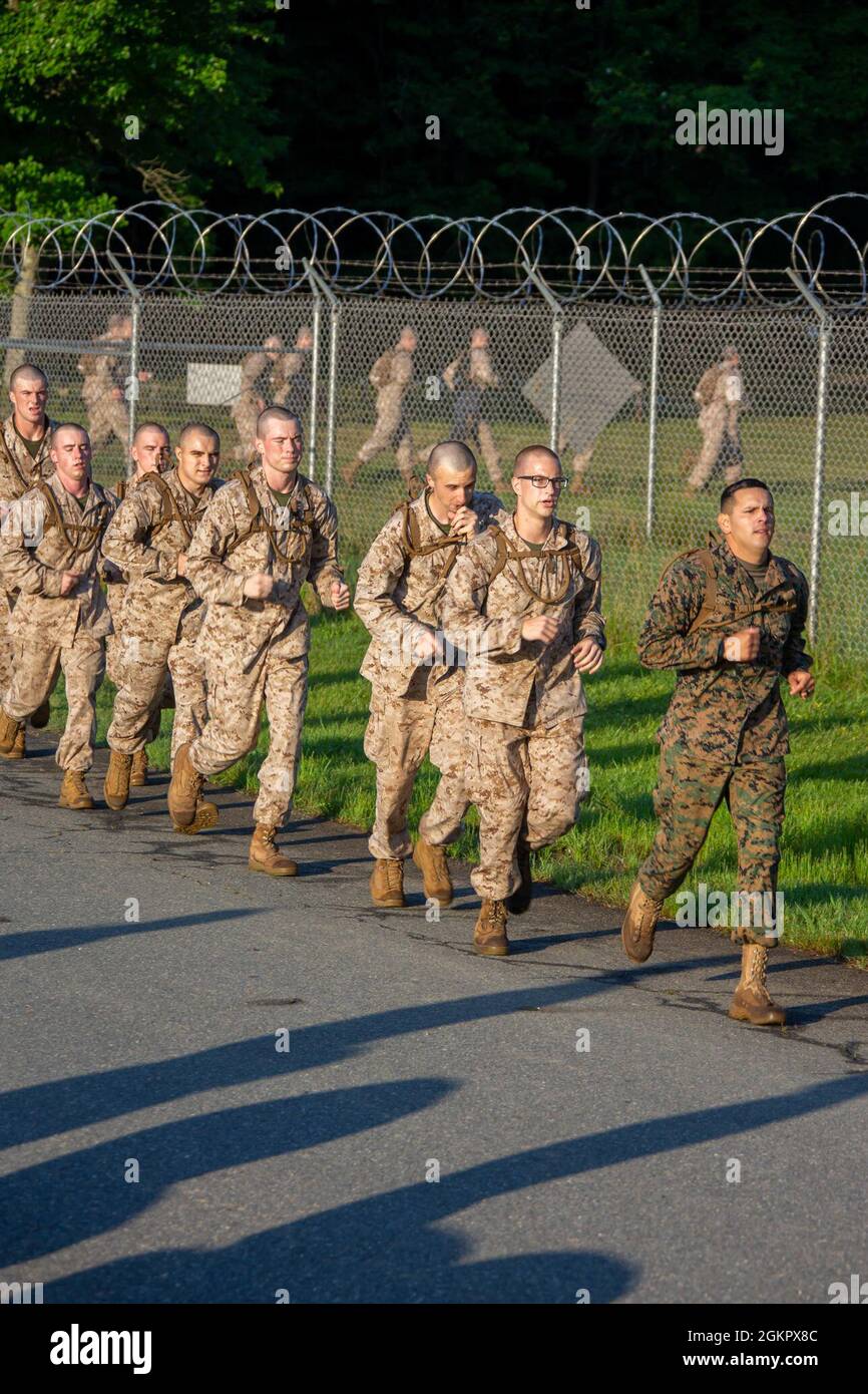 U.S. Marine Corps officer candidates from Lima Company, navigate through an obstacle course