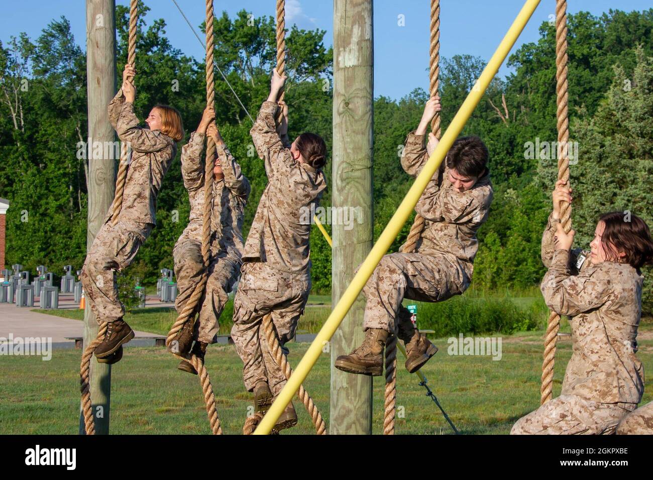 U.S. Marine Corps officer candidates with India Company, navigate through an obstacle course