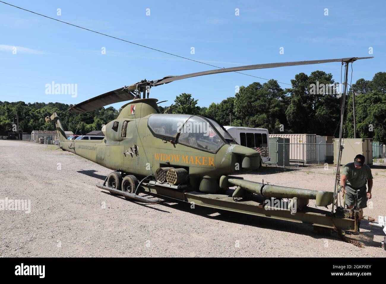 Members of the NC Vietnam Helicopter Pilots Association deliver an AH-1G Huey Cobra Helicopter to the NC National Guard Muse Joint Forces Headquarters in Raleigh, NC, June 16, 2021. The NC National Guard Museum and Learning Center of Excellence collects, preserve and display artifacts, documents, and memorabilia that have specific historical significance to the Army National Guard and the Air National Guard of NC. Stock Photo