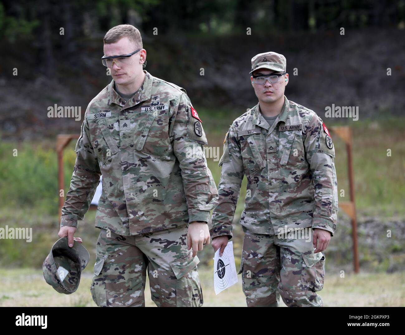 Sgt. Zachariah Storm, left, a medic, and Pfc. Joshua Yi, a radiology  specialist, both assigned to U.S Army Medical Activity-Japan, walk back to  their weapons point during the Regional Health Command-Pacific Best