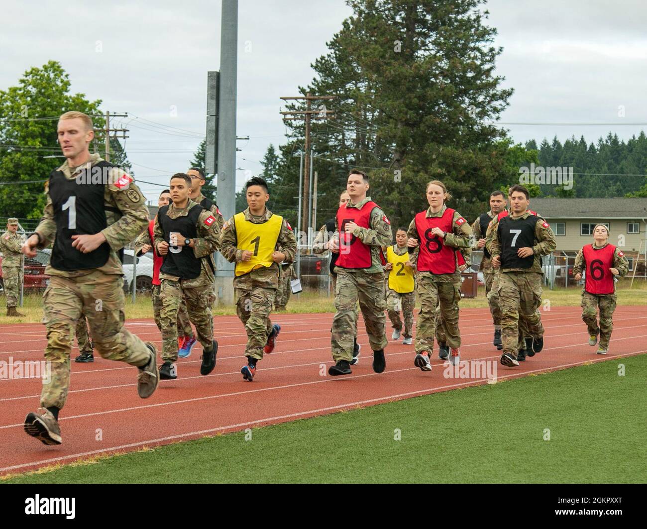 Participants in the Regional Health Command - Pacific best leader  competition perform the 2-mile run event as part of the Army Combat Fitness  Test, at Joint Base Lewis-McChord, Wash., June 16, 2021.