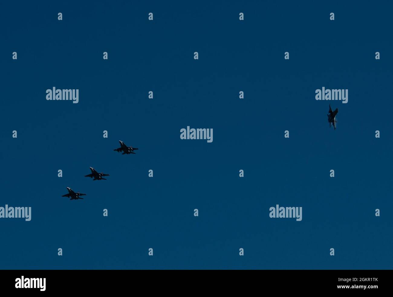 U.S. Marine Corps F/A-18C Hornets assigned to Marine Fighter Attack Squadron 232, fly in a four-man formation over Andersen Air Force Base, Guam, June 16, 2021. VMFA 232 crew flew to Andersen as part of the Aviation Training Relocation program, which is designed to increase operational readiness, improve interoperability and meet training requirements Stock Photo