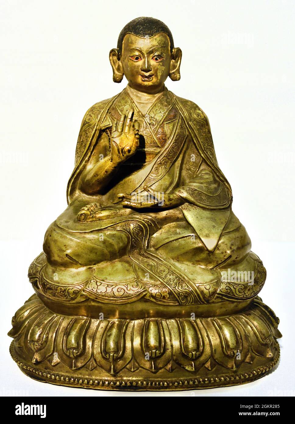 Lama Dpal ldan tshul khrims 1500 - 1699copper, 16.8cm × 13.8cm × 9.5cm,  Central Tibet, Image of the lama Dpal ldan tshul khrims (1333-1399), one of  the masters in the transmission of