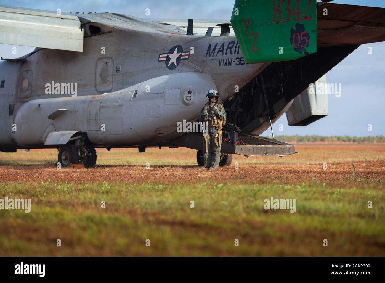 A U.S. Marine with Marine Medium Tiltrotor Squadron 363 (Reinforced) with Marine Rotational Force - Darwin, stands by an MV-22B Osprey after landing at Gove Airport in Nhulunbuy, NT, Australia, June 17, 2021. Marines redeployed from Nhulunbuy to Darwin on MV-22B Ospreys after the successful completion of Exercise Darrandarra. Darrandarra, meaning “together,” demonstrates the Marines Corps’ ability to operate with the Australian Defence Force and reinforce embassies and conduct noncombatant evacuation operations in response to crises and contingencies in the Indo-Pacific region. Stock Photo