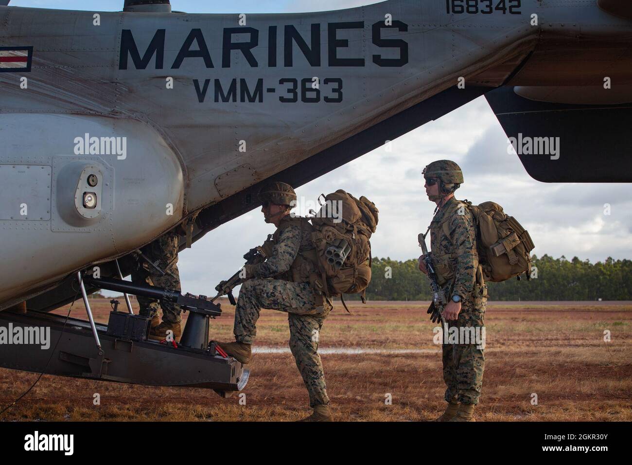 U.S. Marines with Charlie Company, 1st Battalion, 7th Marine Regiment with Marine Rotational Force - Darwin, enter an MV-22B Osprey at Gove Airport in Nhulunbuy, NT, Australia, June 17, 2021. Marines redeployed from Nhulunbuy to Darwin on MV-22B Ospreys after the successful completion of Exercise Darrandarra. Darrandarra, meaning “together,” demonstrates the Marines Corps’ ability to operate with the Australian Defence Force and reinforce embassies and conduct noncombatant evacuation operations in response to crises and contingencies in the Indo-Pacific region. Stock Photo