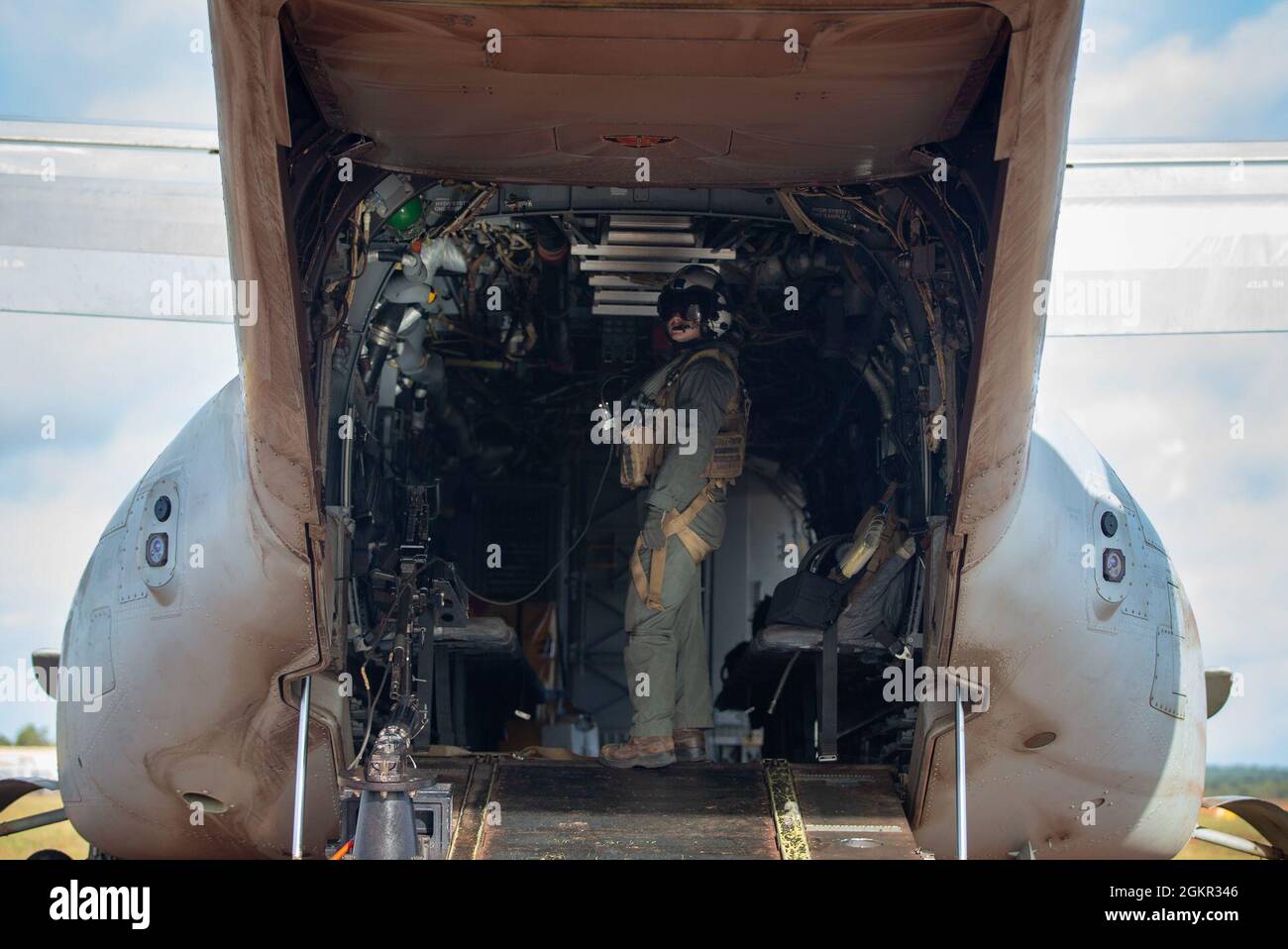 A U.S. Marine with Marine Medium Tiltrotor Squadron 363 (Reinforced) with Marine Rotational Force - Darwin, stands in an MV-22B Osprey after landing at Gove Airport in Nhulunbuy, NT, Australia, June 17, 2021. Marines redeployed from Nhulunbuy to Darwin on MV-22B Ospreys after the successful completion of Exercise Darrandarra. Darrandarra, meaning “together,” demonstrates the Marines Corps’ ability to operate with the Australian Defence Force and reinforce embassies and conduct noncombatant evacuation operations in response to crises and contingencies in the Indo-Pacific region. Stock Photo