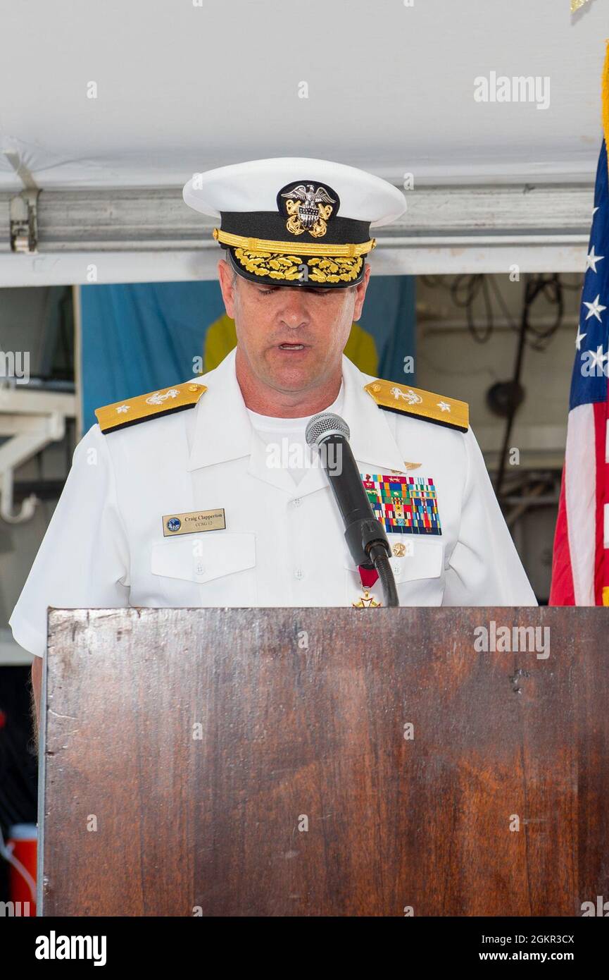 NORFOLK (Jun. 17, 2021) - Rear Adm. Craig Clapperton, Commander, Carrier Strike Group (CSG) 12, reads his orders during the CSG-12 Change of Command ceremony aboard the guided-missile destroyer USS Bulkeley (DDG 84) June 17. Rear Adm. Craig Clapperton turned over his command to Rear Adm. Gregory Huffman. Stock Photo