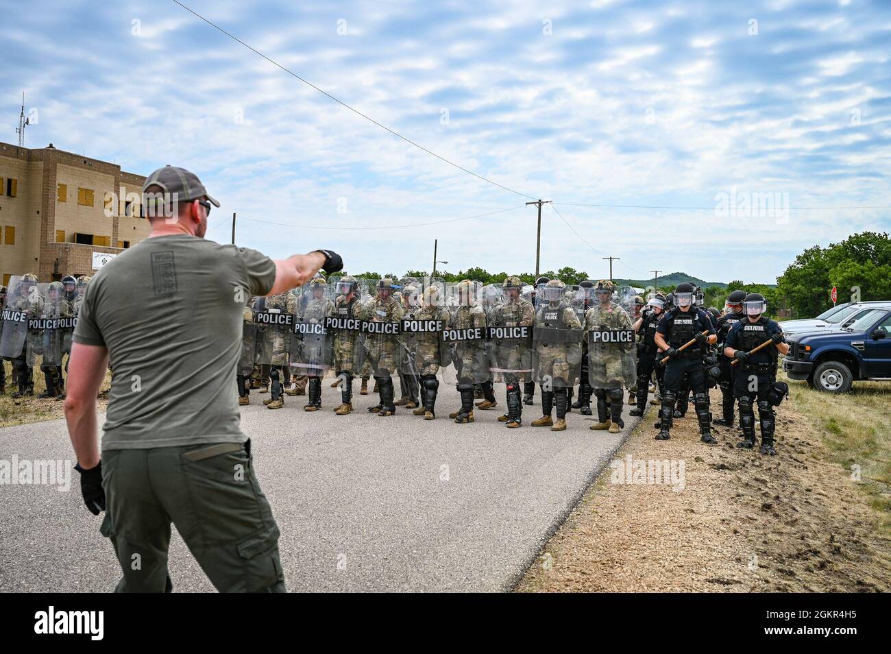 U.S. Air Force security forces members wearing civilian clothing act as protestors in a crowd control exercise during PATRIOT 21 June 17, 2021 at Fort McCoy, Wisconsin. PATRIOT 21 is a training exercise designed for military members to work alongside civilian emergency management and first responders in the same manner they would during a natural disaster so that in the case of a real-world disaster all agencies can maximize their response efforts, provide necessary resources to the communities affected and save more lives. Stock Photo