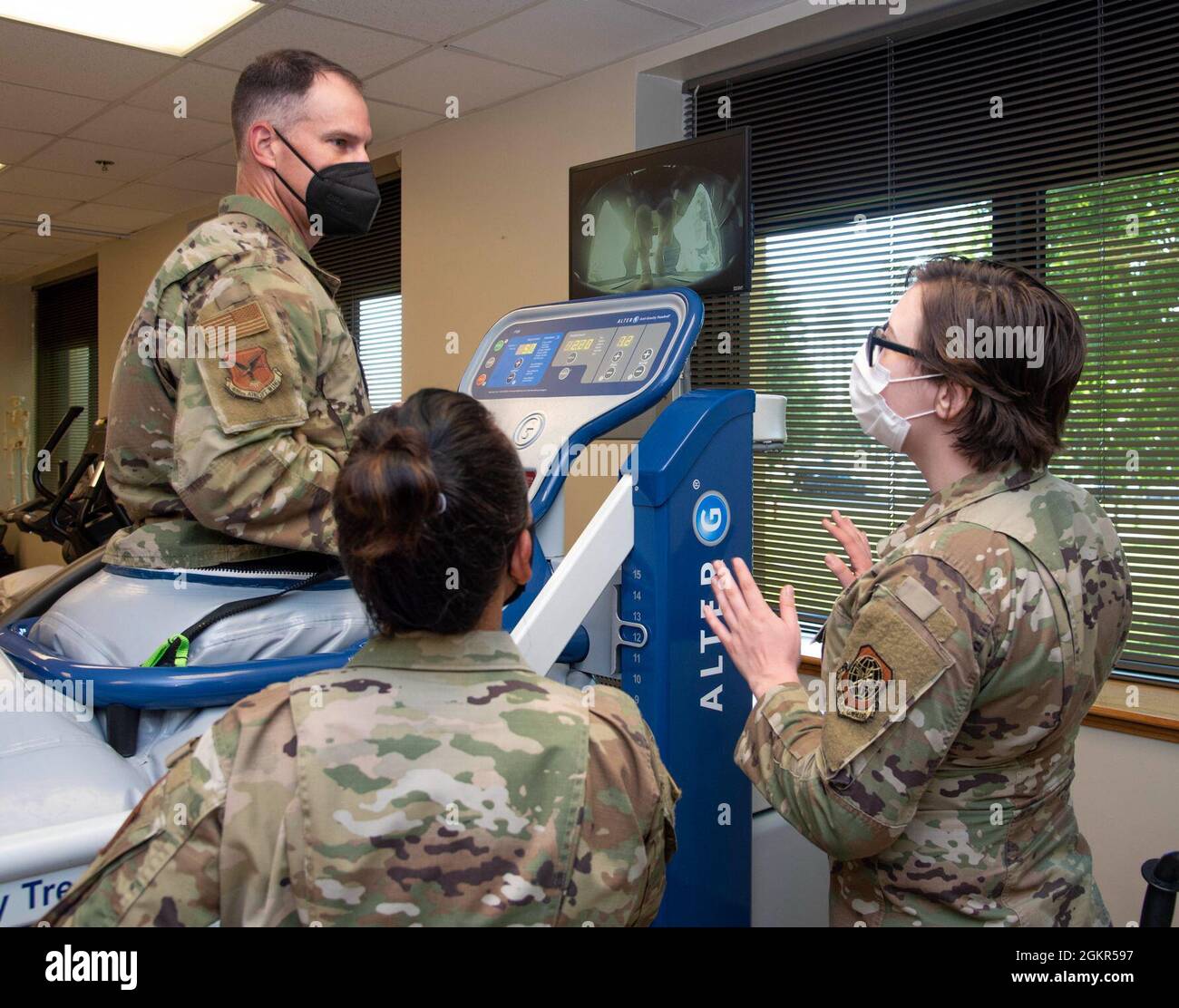 Airmen from the 436th Health Care Operations Squadron physical therapy flight, explain how the anti-gravity treadmill is used to rehabilitate patients to Col. Matt Husemann, 436th Airlift Wing commander, during a 436th Medical Group immersion at Dover Air Force Base, Delaware, June 17, 2021. The immersion gave Husemann hands-on experience of 436th MDG operations. Stock Photo