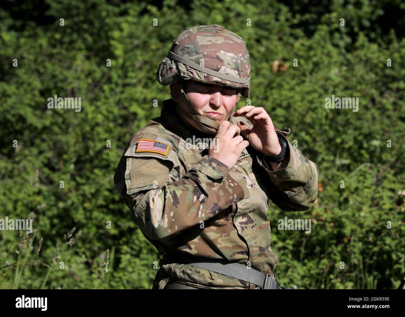 First Lt. Sarah Davis, an Army nurse assigned to Tripler Army Medical  Center, Honolulu, snaps on her helmet during the Regional Health  Command-Pacific Best Leader Competition, Joint Base Lewis-McChord, Wash.,  June 17,
