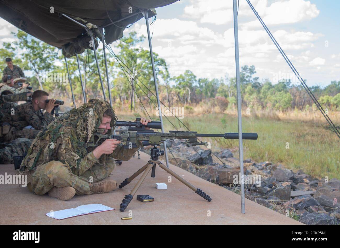 An Australian Army soldier sights in before firing a Blaser Tactical 2  Sniper Rifle during exercise Southern Jackaroo at Mount Bundey Training  Area, June 17, 2021. U.S. Marines with 1st Battalion, 7th