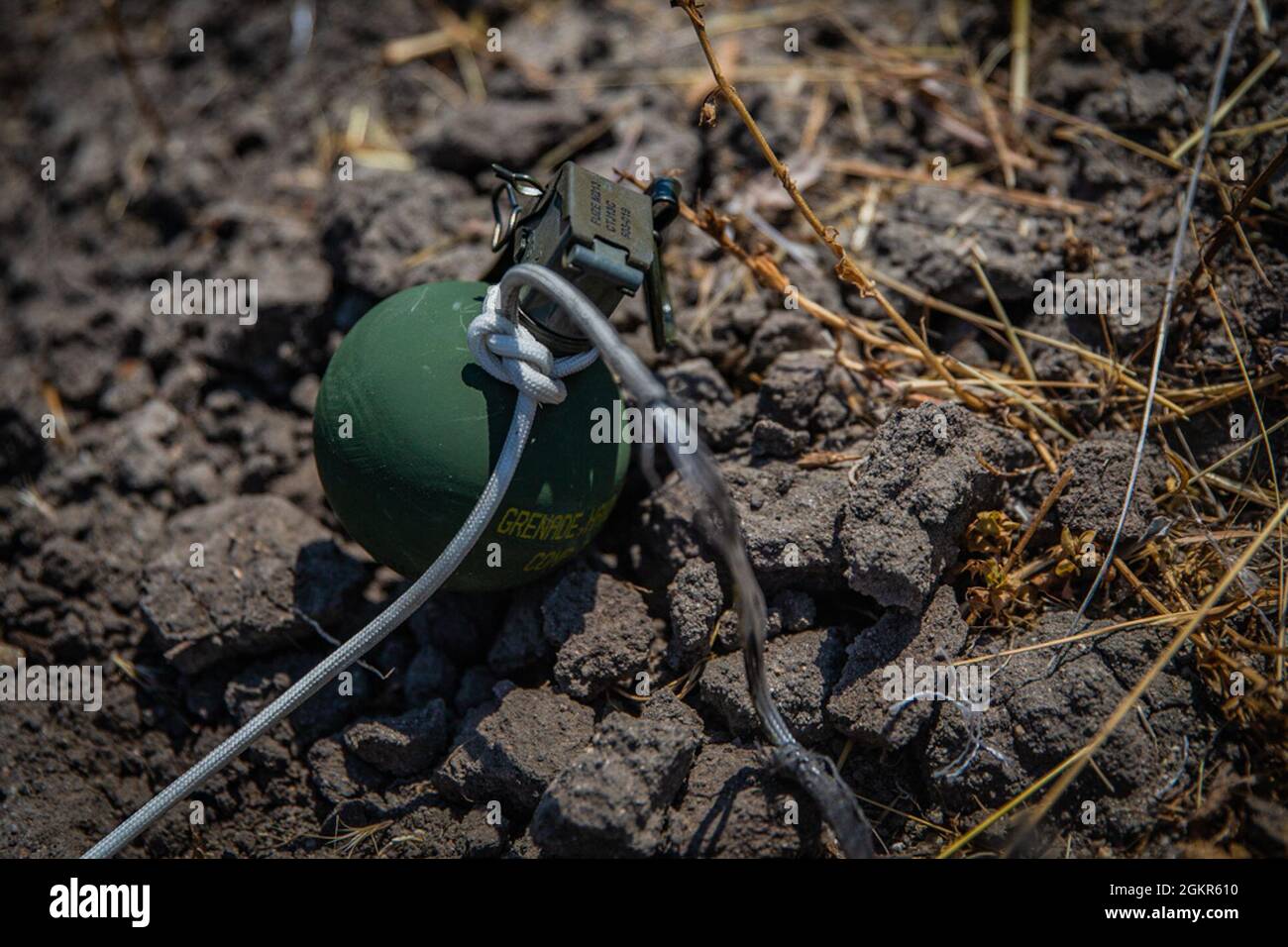 A close up shot of a M67 grenade after being prepped to be detonated by