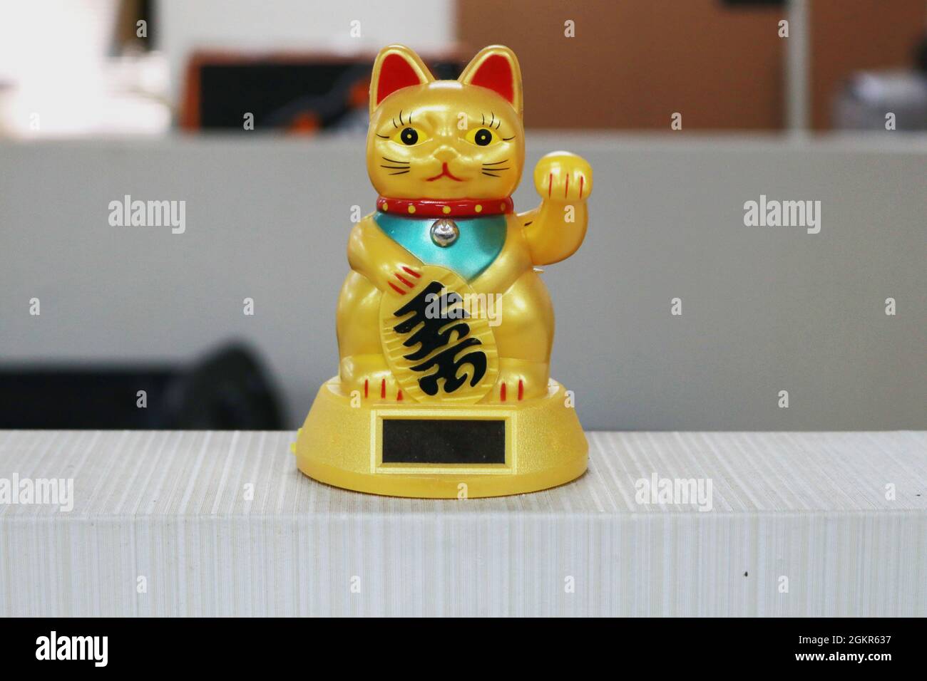 These decorations are called maneki neko or often referred to as fortune cats. Maneki neko himself must always be in business places.This little cat s Stock Photo