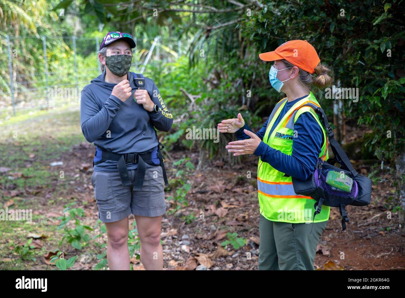 Adrienne Loerzel, a Naval Facilities Engineering Systems Command (NAVFAC)  Marianas forest enhancement program manager at Marine Corps Base (MCB) Camp  Blaz, right, briefs Haldre Rogers, Marianas Terrestrial Conservation  Conference co-organizer and assistant