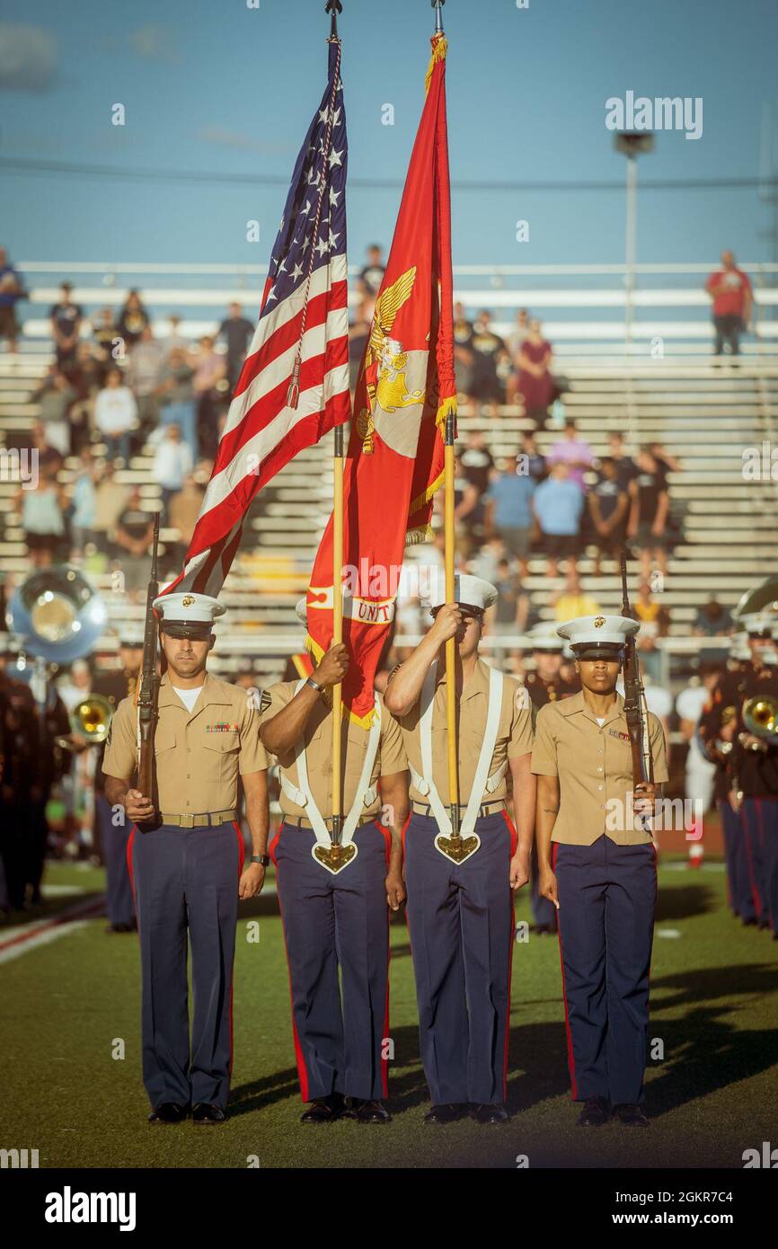Sergeant La'Keisha Crews, Staff Sgt. Jimmy Hall III, Staff Sgt. Ross Garrie and Sergeant Raul Cruz post the colors during the playing of the national anthem at the 8th Annual Basilone Bowl at Bridgewater-Raritan Regional High School, in Bridgewater, New Jersey, June 16, 2021. The Basilone Bowl is an All-Star football game played in honor of legendary Medal of Honor recipient, U.S. Marine Corps Gunnery Sgt. John Basilone, who grew up in nearby Raritan, New Jersey. Stock Photo