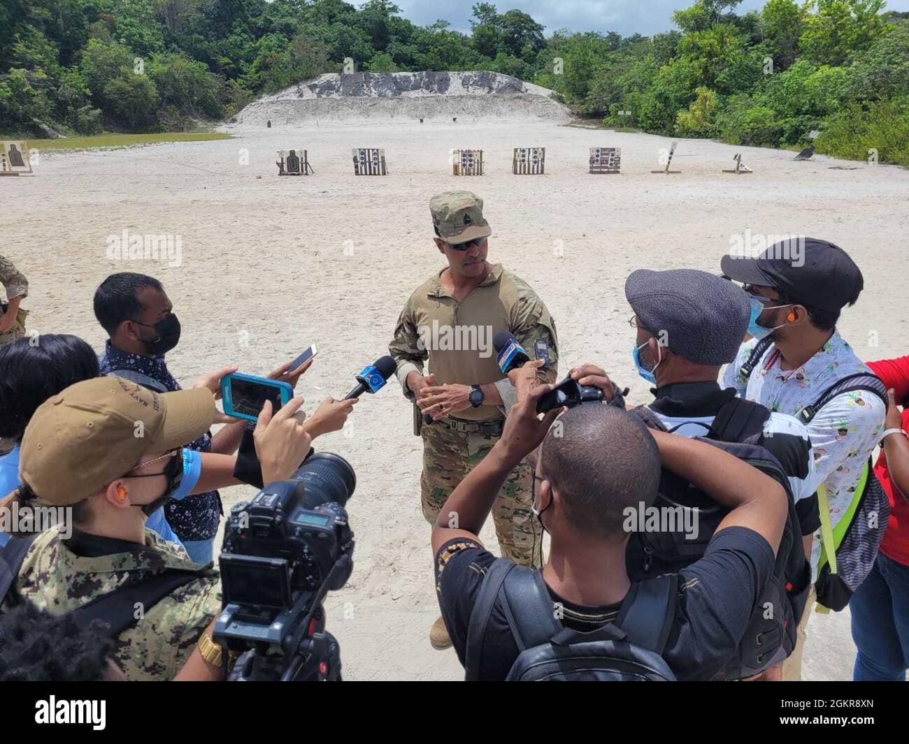 210618-N-YY107-001 CAMP STEPHENSON, Guyana - (June 18, 2021) Sgt. First Class Anthony Calvi of Charlie Co. 2-54 Security Force Assistance Brigade (SFAB) talks with Guyanese media about training operations during exercise Tradewinds 2021. Tradewinds 2021 is Caribbean security-focused, multi-dimensional exercise conducted in the ground, air, sea, and cyber domains. U.S. forces join participating nations to conduct joint, combined, and interagency training focused on increasing regional cooperation in complex multinational security operations. Stock Photo