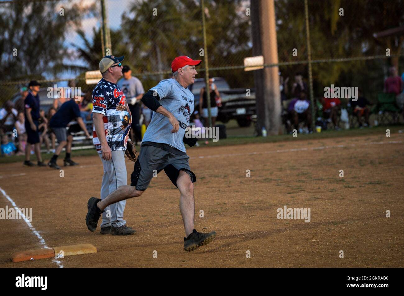 U.S. Air Force Brig. Gen. Jeremy Sloane, 36th Wing commander, runs passed first base during the Chief’s versus Eagle’s softball game at Andersen Air Force Base, Guam, June 18, 2021. The final score ended with the Eagle’s defeating the Chief’s 18 to 14. Stock Photo
