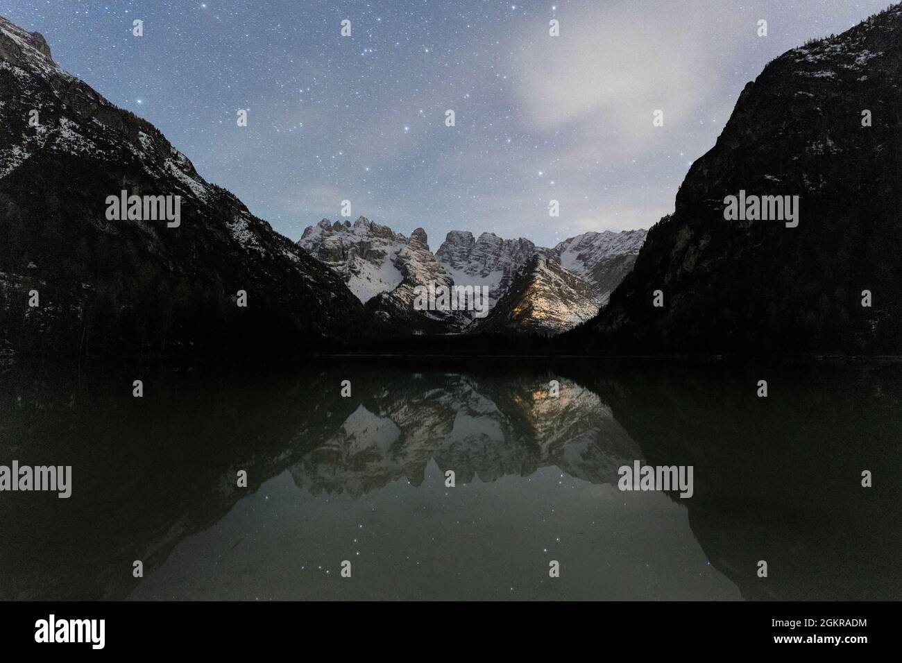 Starry sky over Cristallo group mountains reflected in Lake Landro, Dolomites, Bolzano province, South Tyrol, Italy, Europe Stock Photo