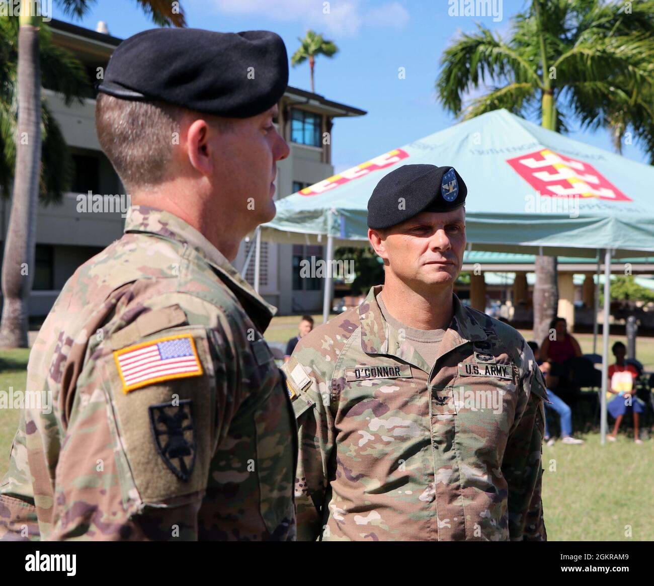 Lt. Col. Brian Young with the Support Battalion, 196th Infantry Brigade and Col. Ryan O'Connor, Commander of the 196th Infantry Brigade, stand at attention during the Change of Command Ceremony, Fort Shafter Flats, Hawaii, June 18, 2021. This event is signified by honoring the outgoing Commander and receiving the incoming Commander. The Support Battalion trains and prepares the Total Army Force by participating in active Army exercises and partnering with Army Reserve units under the Ninth Mission Support Command and Hawaii Army National Guard, building and sustaining readiness to achieve Nati Stock Photo