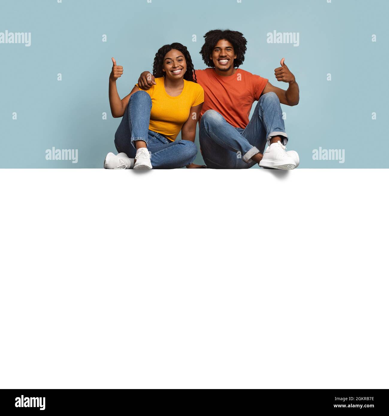 Positive black couple sitting hi-res stock photography and images - Alamy