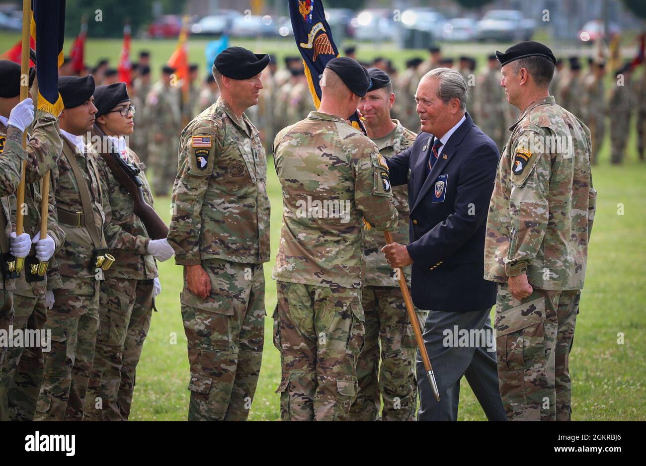 Col. Mark Federovich, incoming commander of the 3rd Brigade Combat Team, 101st Airborne Division (Air Assault), receives the regimental colours from Command Sgt. Maj. (Retired) Gerald Counts, the Honorary Colonel of the 187th Infantry Regiment, during a change of command ceremony on Fort Campbell, KY June 18, 2021.     The passing of the regimental colours symbolizes the continuation of the historic lineage of the 187th linking the Soldiers of yesterday to those serving today. Stock Photo