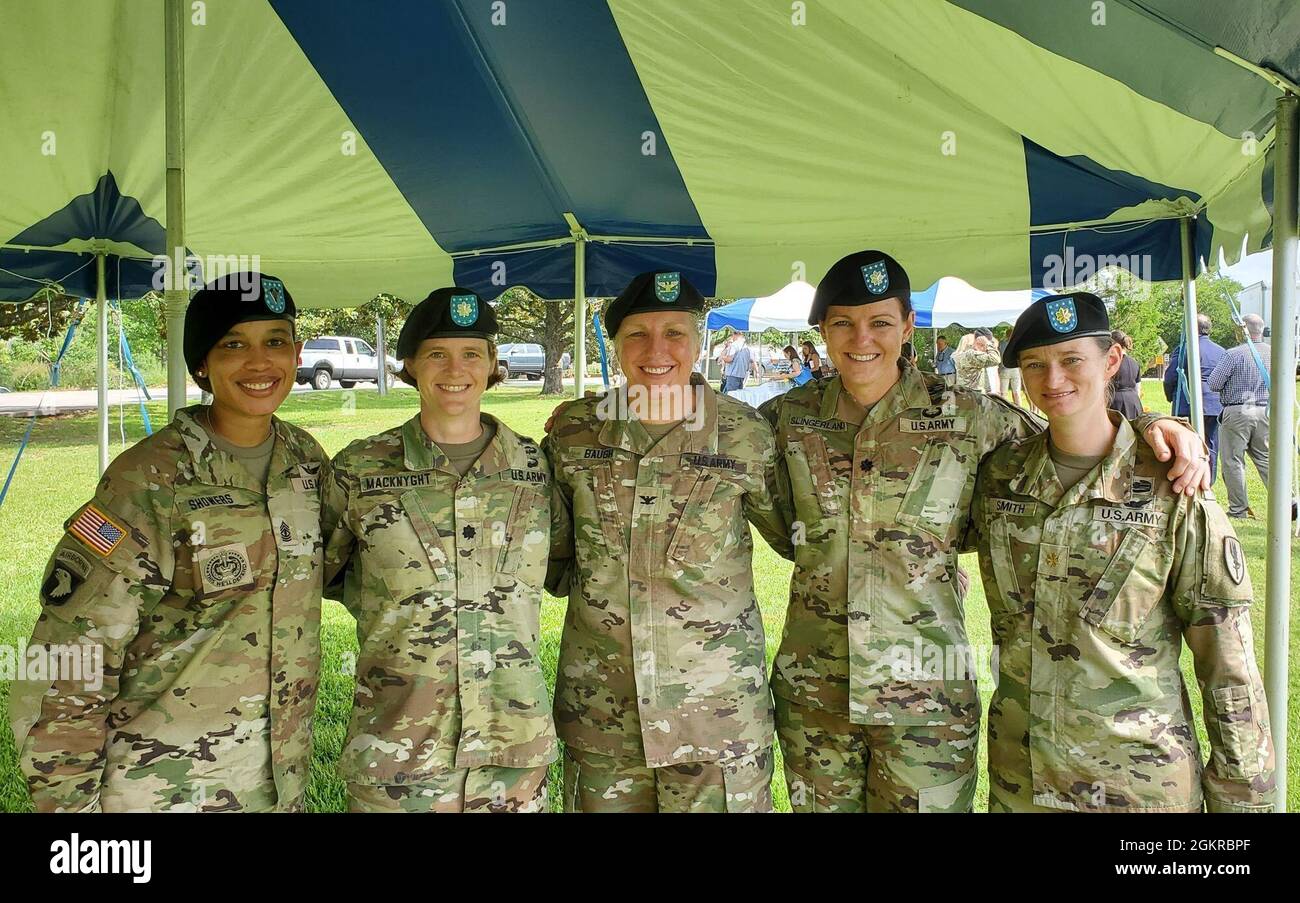 U.S. Army Col. Tammy Baugh, 1st Aviation Brigade commander, stands with 1st Sgt. Natalie Showers, Company A, 1st Battalion, 145th Aviation Regiment; Lt. Col. Julie MacKnyght, 1-145 Aviation Regiment commander; Lt. Col. Katie Slingerland, 1st Battalion, 145th Aviation Regiment commander, and Maj. Kim Smith, Company D, 1st Battalion, 145th Aviation Regiment commander, following Baugh's relinquishment of command at Fort Rucker, Alabama, June 18, 2021.  The 1st Aviation Brigade had women in command at brigade and battalion levels during Baugh's tenure, a notable brigade first. Stock Photo