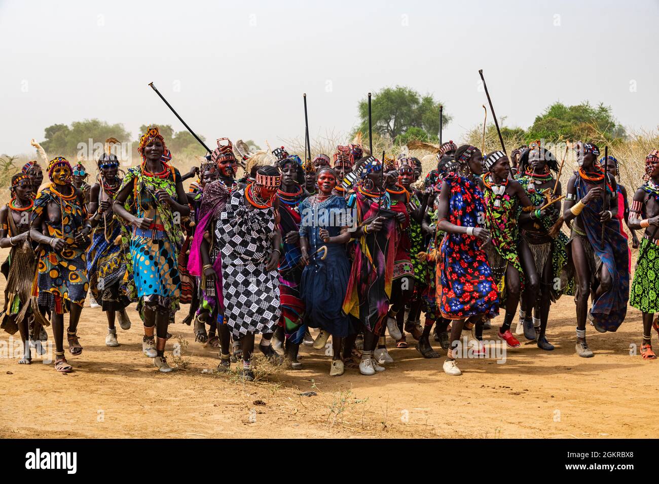 Traditional dressed women of the Jiye tribe dancing and singing, Eastern Equatoria State, South Sudan, Africa Stock Photo