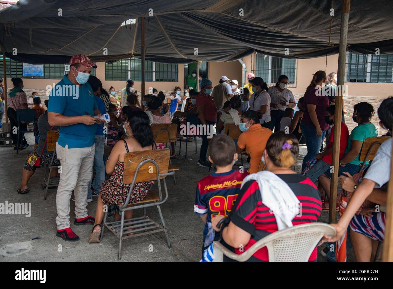 Residents of Choloma, Honduras, receive medical care during a medical