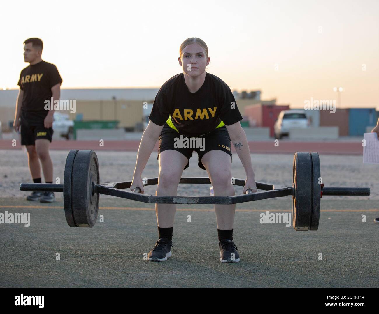 Spc. Rena Bailey, a wheeled vehicle mechanic assigned to Area Support Group  - Kuwait, performs a deadlift repetition during the Army Combat Fitness  Test for the U.S. Army Central 2021 Best Warrior