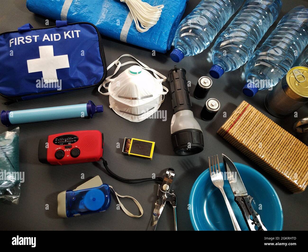 Disaster management includes preparing a disaster kit that can be contained in a go bag.These items should include a first aid kit,food,water Stock Photo