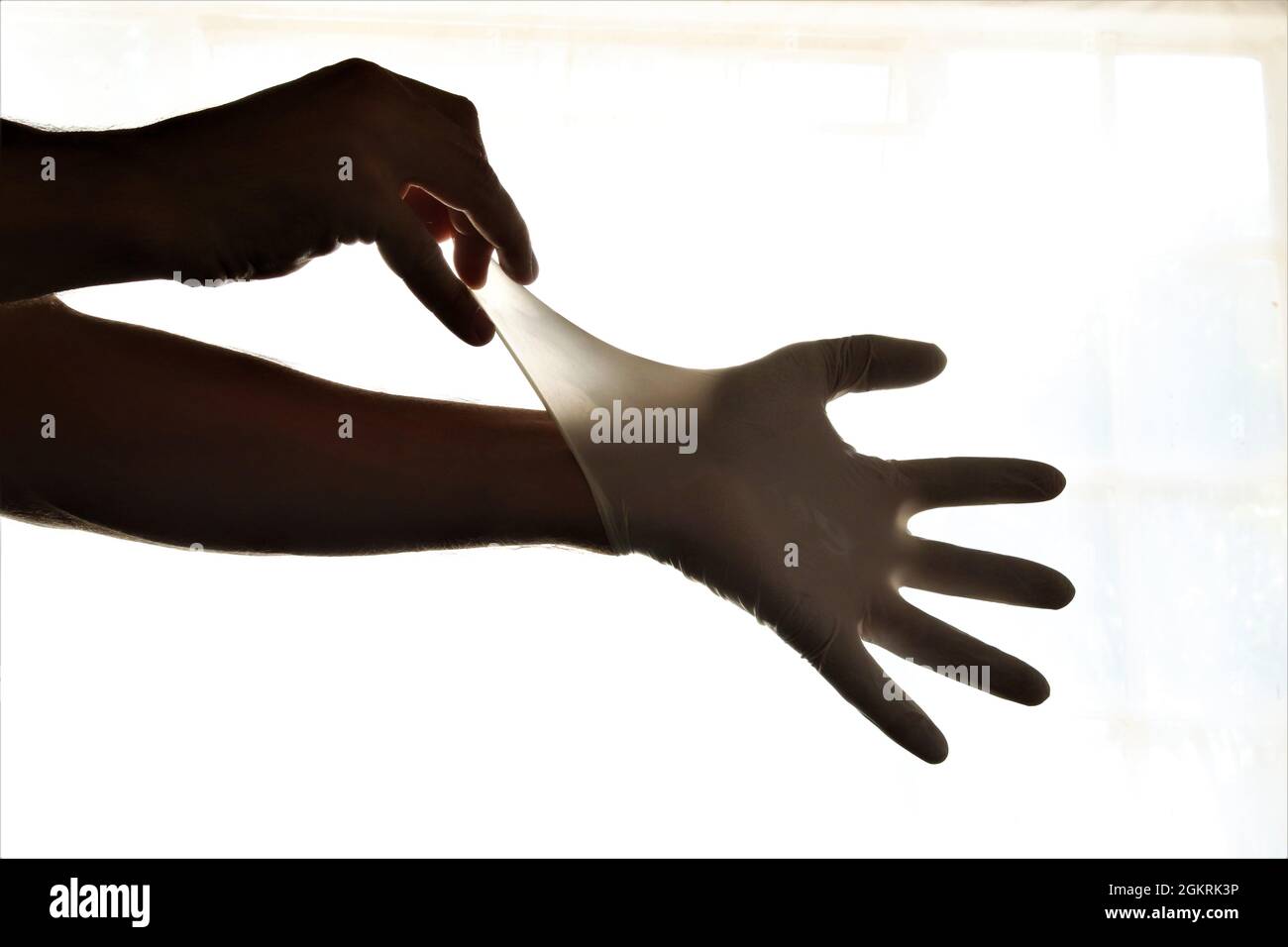 Removing latex gloves from hands.Once gloves have been removed make