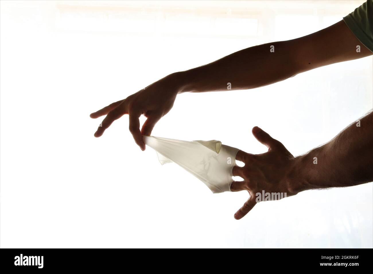 Removing latex gloves from hands.Once gloves have been removed make