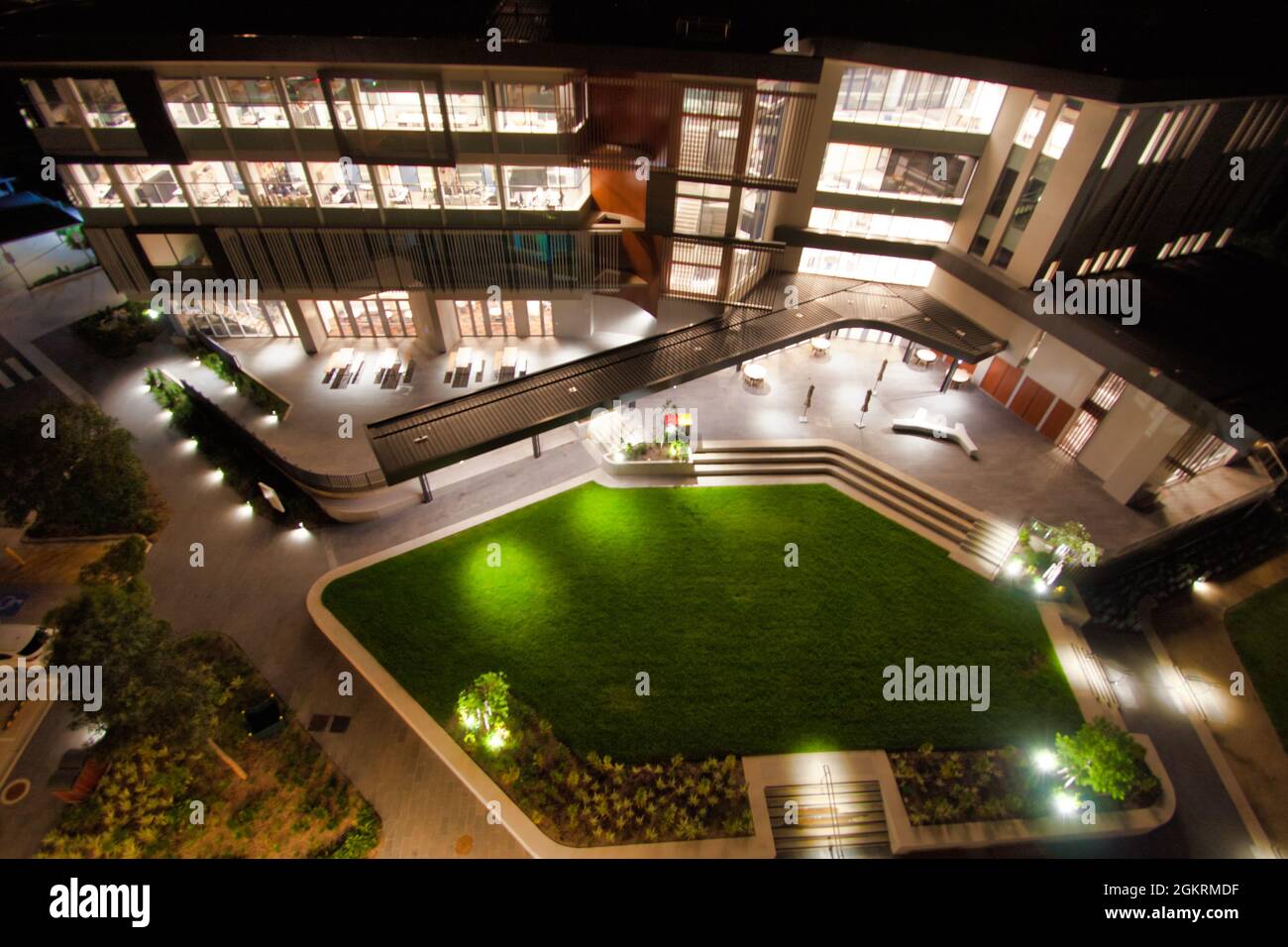 SYDNEY, AUSTRALIA - Feb 14, 2020: A high angle shot of an office building and courtyard with bright lights at night in Sydney Stock Photo