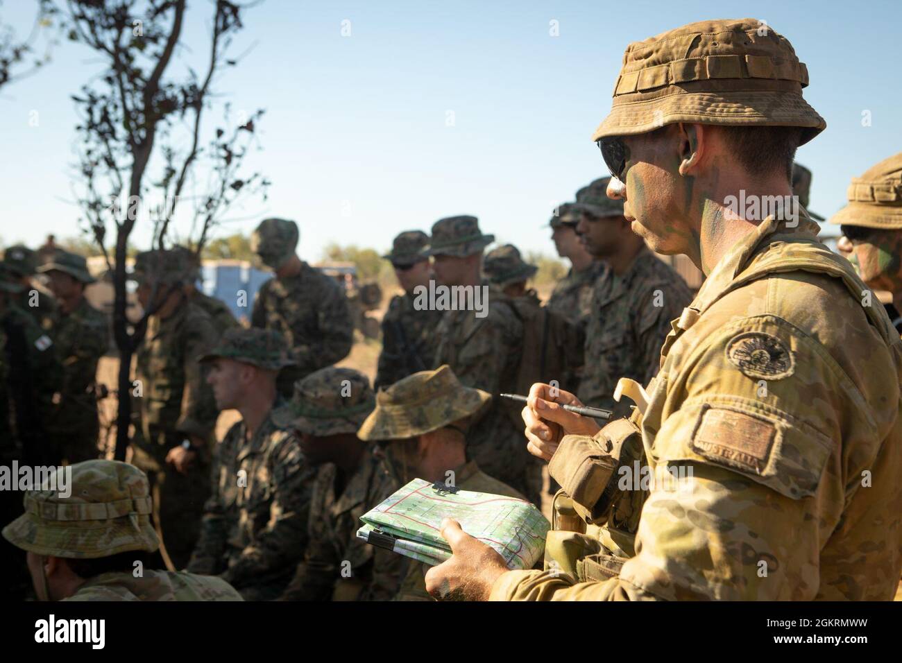 An Australian Army Solider references - An Australian Army Solider References A Map During A Rehearsal Of Concept In Preparation For Training During Exercise Southern Jackaroo At Mount Bundey Training Area June 22 2021 Us Marines Australian Army Soldiers And Japan Ground Self Defense Force Soldiers Prepare For A Culminating Event To Exercise Their Combined Capability To Give Mounted And Dismounted Support To Small Unit Ground Maneuvers While Utilizing Multiple Weapons Systems Defense Ties Between The United States Allies And Partner Nations Are Critical To Regional Security Cooperation And Integration Of Our Combined Capa 2GKRMWW 