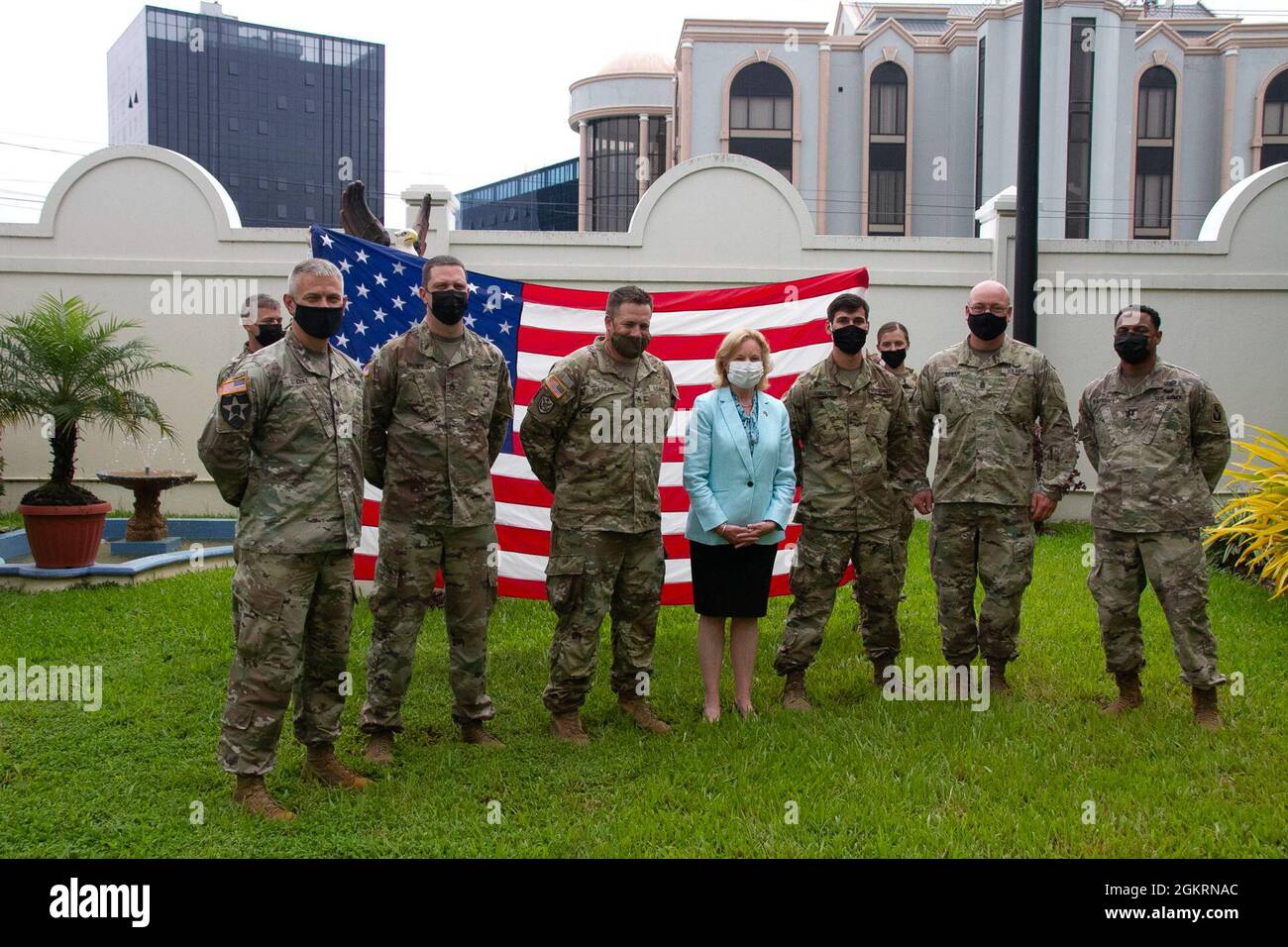 Soldiers assigned to 75th Troop Command, Kentucky National Guard, and the U.S. Ambassador to Guyana Sarah Ann Lynch (center), pose for a photo, after completing their Oath of Renlistment, given by Lt. Col. Timothy Stark, commander, 75th TC (left), during Tradewinds 21, at the U.S. Embassy in Guyana, June 22, 2021. Tradewinds 21 is a U.S. Southern Command (SOUTHCOM) sponsored Caribbean security-focused exercise in the ground, air, sea, and cyber domains; working with partner nations to conduct joint, combined, and interagency training, focused on increasing regional cooperation and stability. Stock Photo