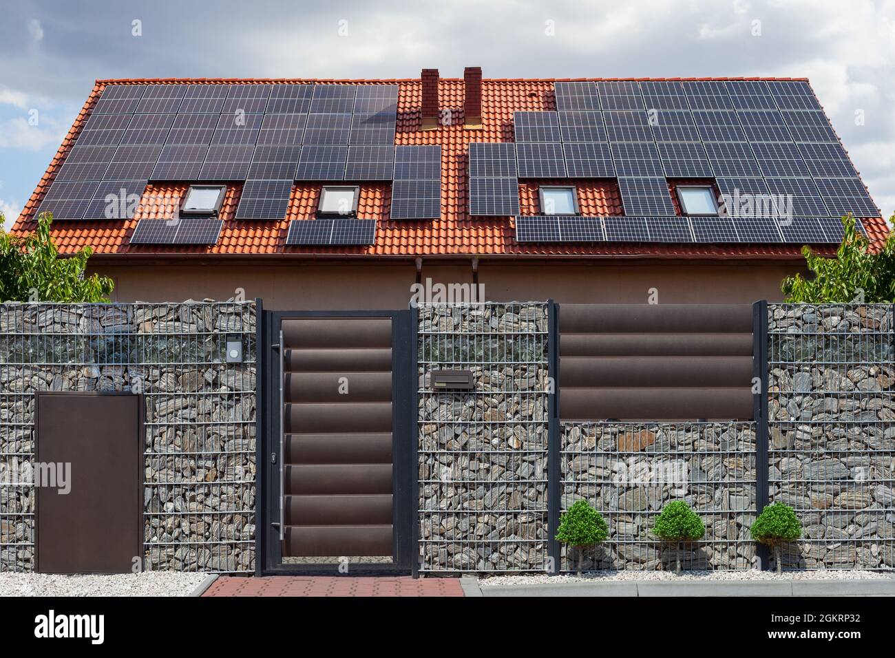 Solar panels on a gable roof. Beautiful, large modern house and solar