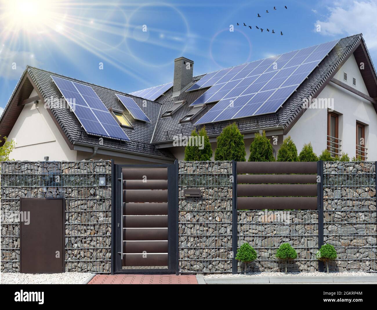 Solar panels on a gable roof. Beautiful, large modern house and solar