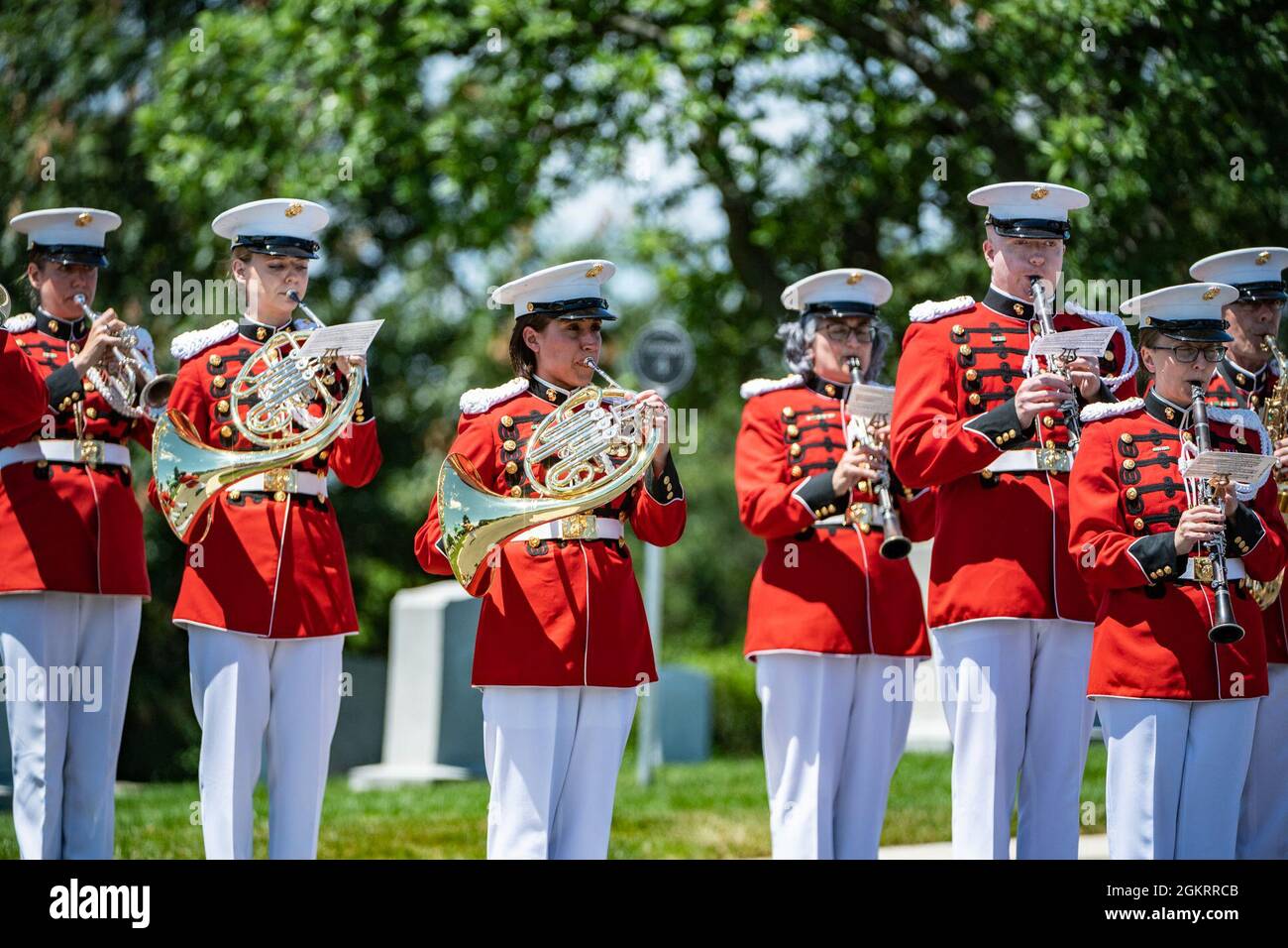 Marines from the “The President’s Own” Marine Band  help conduct military funeral honors for U.S. Marine Corps 1st Lt. John Warner in Section 4 of Arlington National Cemetery, Arlington, Virginia, June 23, 2021.    Former Senator for Virginia and former Secretary of the Navy, Warner was born on Feb. 18, 1927 in Washington, D.C. He joined the U.S. Navy at age 17 in 1945 and served during the final months of World War II. After graduating from the University of Virginia School of Law, Warner joined the U.S. Marine Corps in 1950 to serve in the Korean War. After his military service and receiving Stock Photo